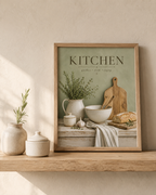Sage green Kitchen gather cook enjoy artwork with herbs, ceramic jug, mixing bowl, wooden utensils, bread and garlic styled in a shelf display