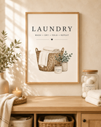 Laundry basket with folded linens, foliage and wash dry fold repeat lettering styled in a laundry room console