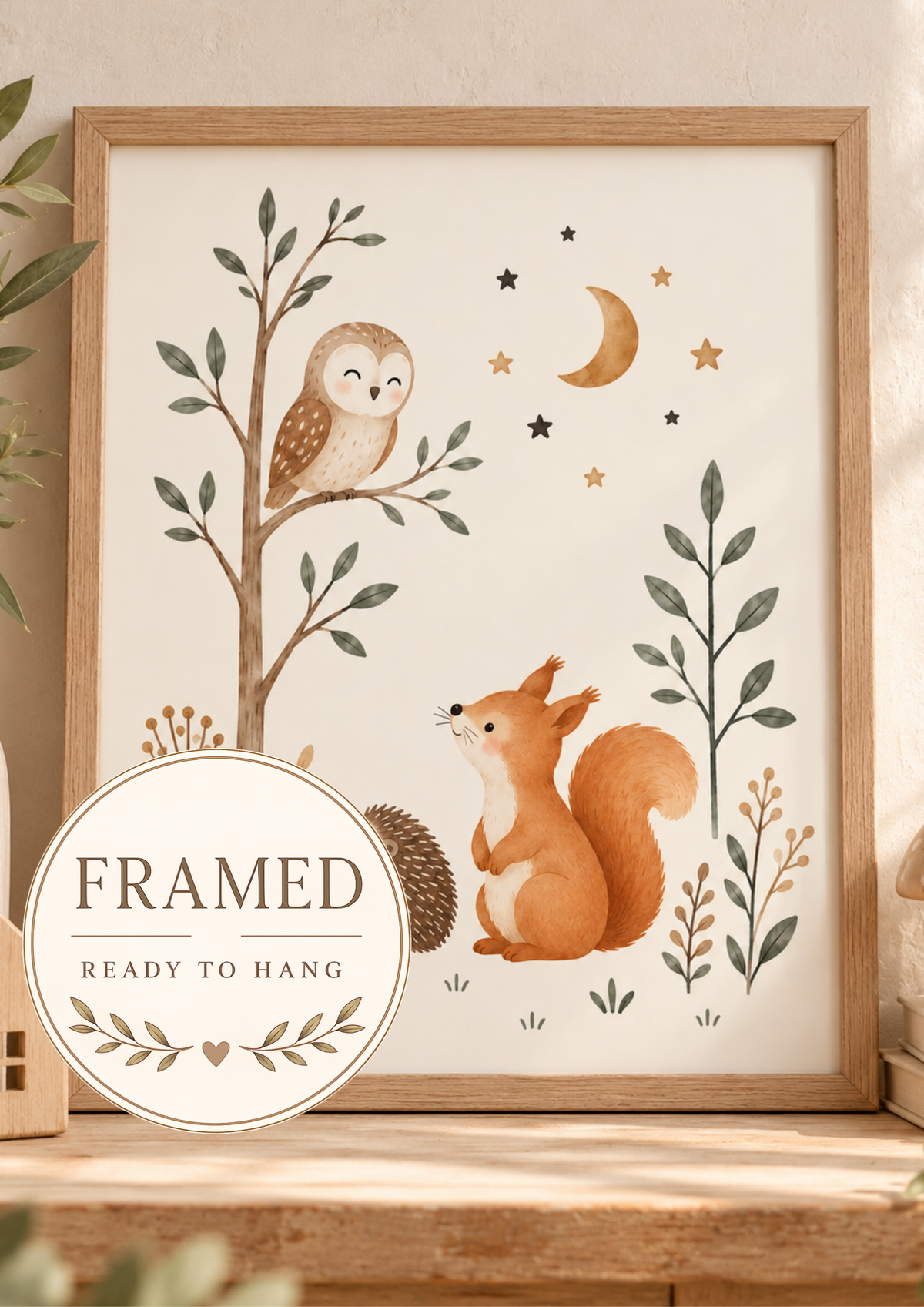 Woodland nursery owl, squirrel and hedgehog beneath a crescent moon and stars; framed and ready to hang badge