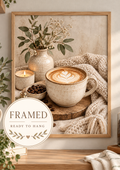 Cosy cappuccino with latte art, ceramic vase, candle and neutral knitted textures; framed and ready to hang badge