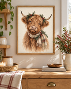 Christmas Highland cow watercolour with tartan scarf, evergreen sprigs and red berries styled in a kitchen