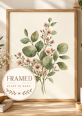 Sage green leaves and delicate blush pink flowers in a botanical watercolour arrangement; framed and ready to hang badge