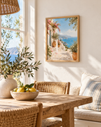 Mediterranean coastal scene with pink bougainvillea, whitewashed walls, terracotta pots and blue sea styled in a dining room