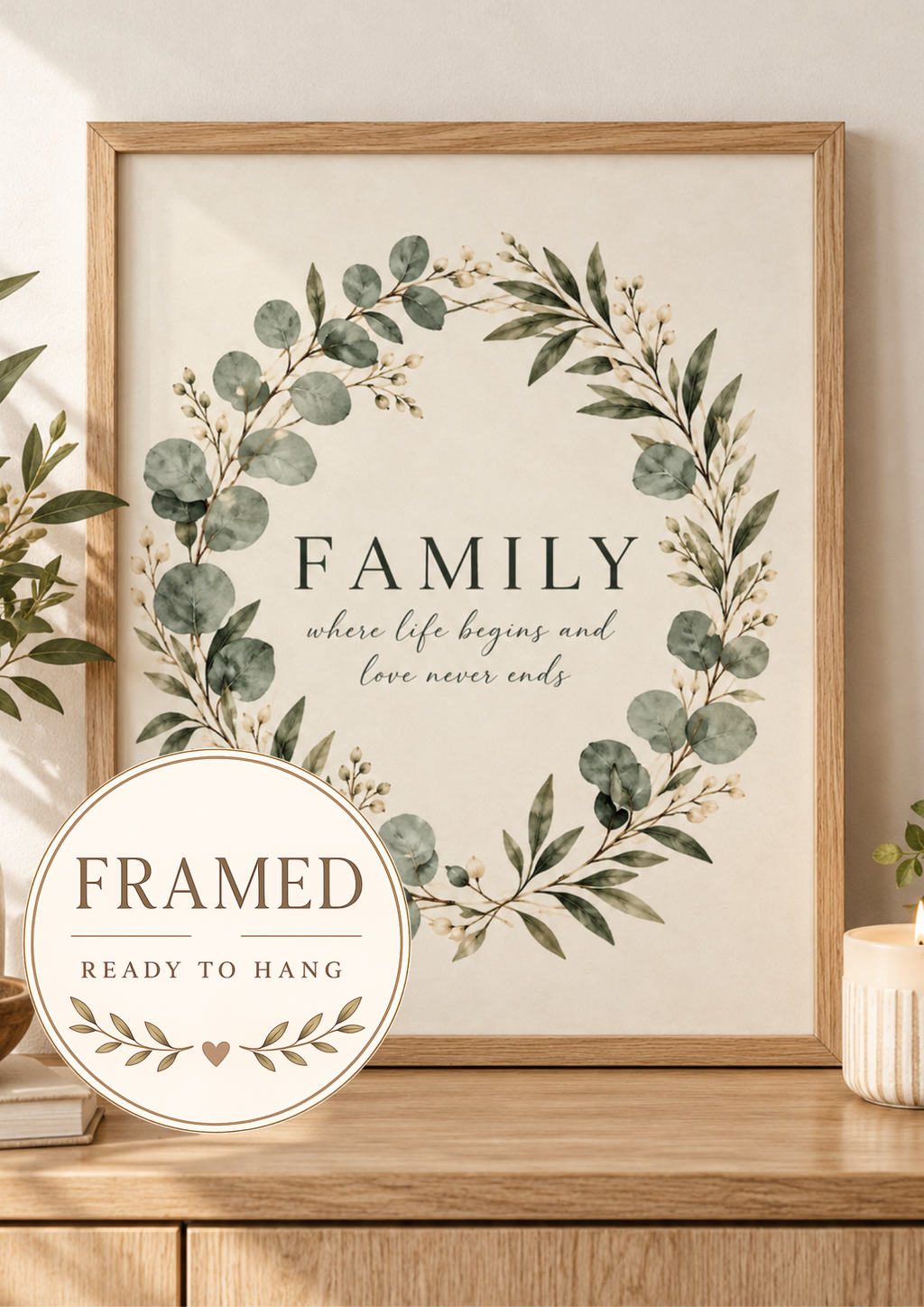 Family where life begins and love never ends quote surrounded by a sage green eucalyptus and white flower wreath; framed and ready to hang badge