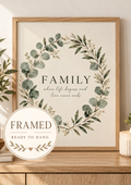 Family where life begins and love never ends quote surrounded by a sage green eucalyptus and white flower wreath; framed and ready to hang badge