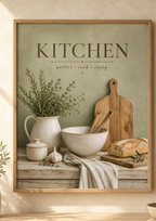 Sage green Kitchen gather cook enjoy artwork with herbs, ceramic jug, mixing bowl, wooden utensils, bread and garlic styled in a kitchen