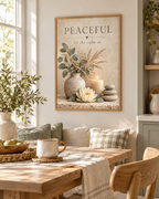 Peaceful let the calm in botanical artwork with eucalyptus, dried grasses, lotus flower, candle and stacked stones styled in a dining area