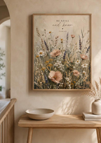 Be Still and Know Psalm 46:10 artwork with a softly painted wildflower meadow above a sideboard