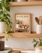 Reading Room still life with books, reading glasses, coffee, candle and flowers in a cream jug in a styled home display