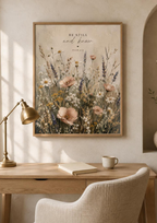 Be Still and Know Psalm 46:10 artwork with a softly painted wildflower meadow above a desk