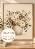 Front image of cream floral bouquet in a rustic vase, marked framed and ready to hang