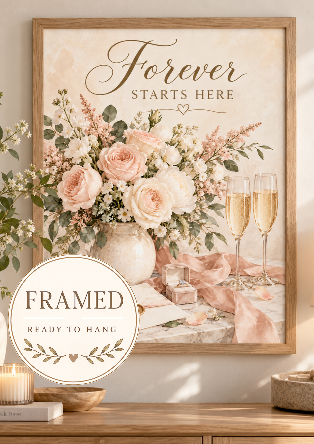 Forever Starts Here wedding artwork with blush and ivory roses, muted green foliage, champagne glasses, engagement ring, ribbons and wedding stationery; framed and ready to hang badge