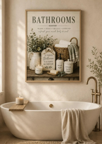 Farmhouse bathroom typography with wash soak relax unwind wording, sage foliage, towels, wicker basket and ceramic accessories styled in a bathroom
