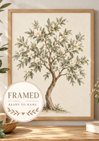 Watercolour botanical tree with sage green leaves, ivory white blossoms and a curved natural trunk on warm ivory; framed and ready to hang badge
