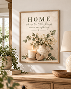 Home quote artwork above a wooden console with a bowl and books