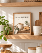 Tea and Biscuits quote, brew dunk unwind, with speckled ceramic mug, biscuits, sage foliage and cream background styled in a kitchen shelf display