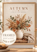 Autumn crisp air cosy moments artwork with dried flowers, eucalyptus and grasses in a rustic vase, candle and knitted blanket; framed and ready to hang badge