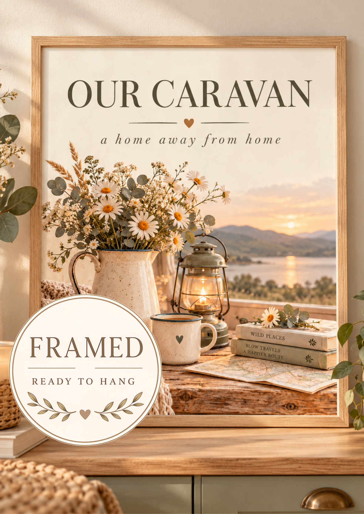 Our Caravan a home away from home quote with daisies, lantern, mug, knitted blanket and lakeside sunset; framed and ready to hang badge
