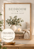 Bedroom rest dream unwind botanical artwork with eucalyptus, ceramic vase, candle, books and knitted blanket; framed and ready to hang badge