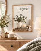 Bedroom rest dream unwind botanical artwork with eucalyptus, ceramic vase, candle, books and knitted blanket styled in a dresser