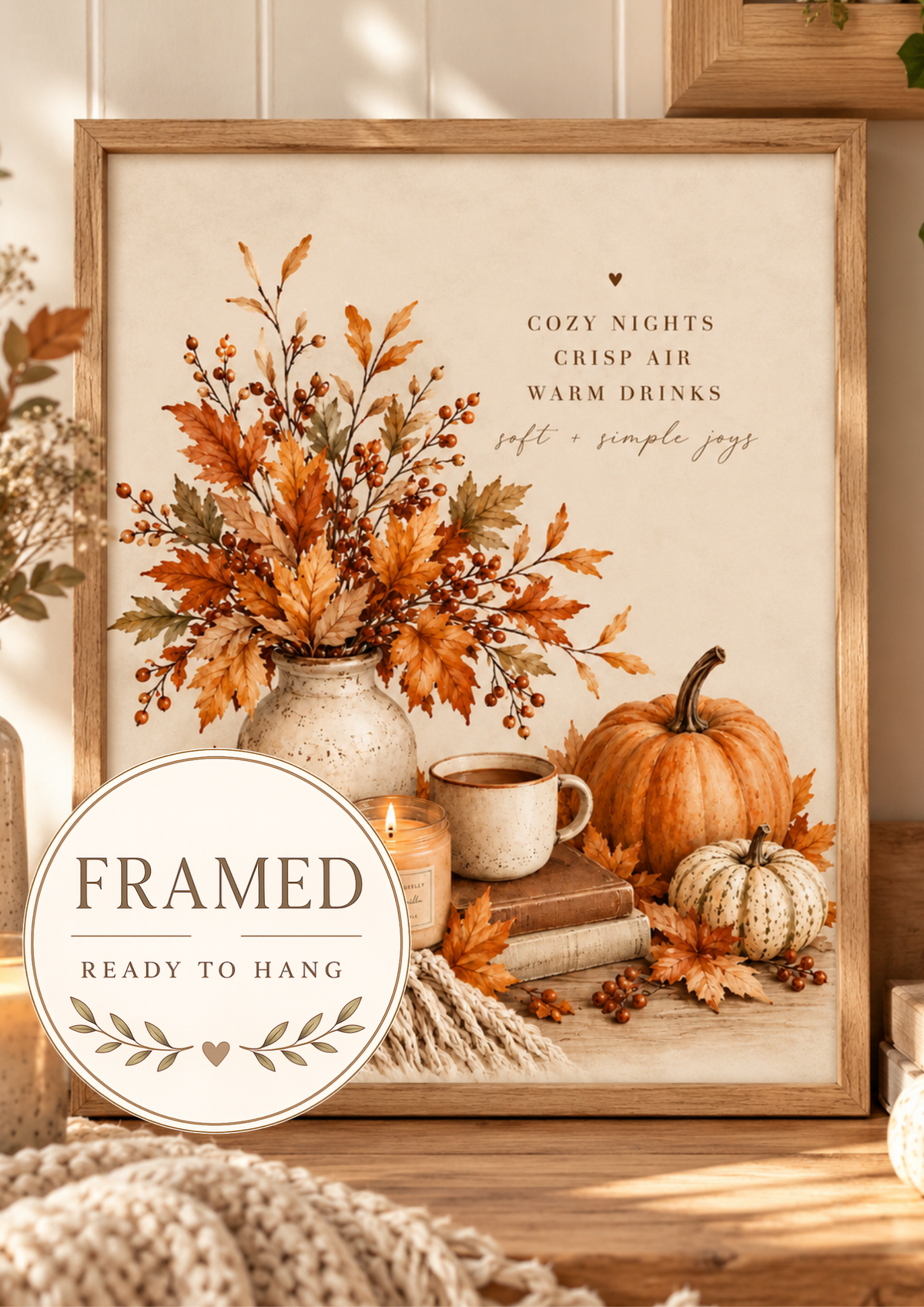 Autumn cosy nights quote with pumpkins, falling leaves, rustic vase, warm drink and knitted blanket; framed and ready to hang badge