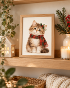 Fluffy Christmas tabby kitten wearing a tartan scarf and holly styled in a shelf display