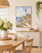 Painterly coastal landscape with white lighthouse and cottage, blue ocean waves, rocky shore, sandy path, wooden fence and coastal grasses styled in a dining room