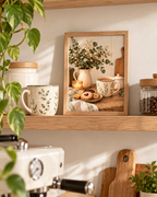Cosy coffee and biscuits still life with botanical ceramic mug, white flowers, sage greenery, candle and rustic wooden tabletop styled in a kitchen shelf display