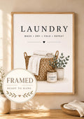Laundry basket with folded linens, foliage and wash dry fold repeat lettering; framed and ready to hang badge